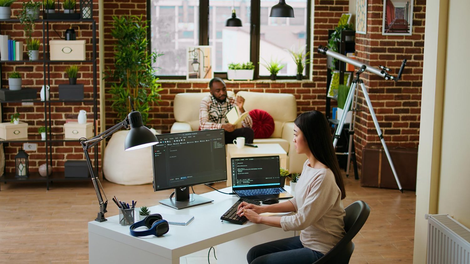 Female developer coding cloud computing applications on PC