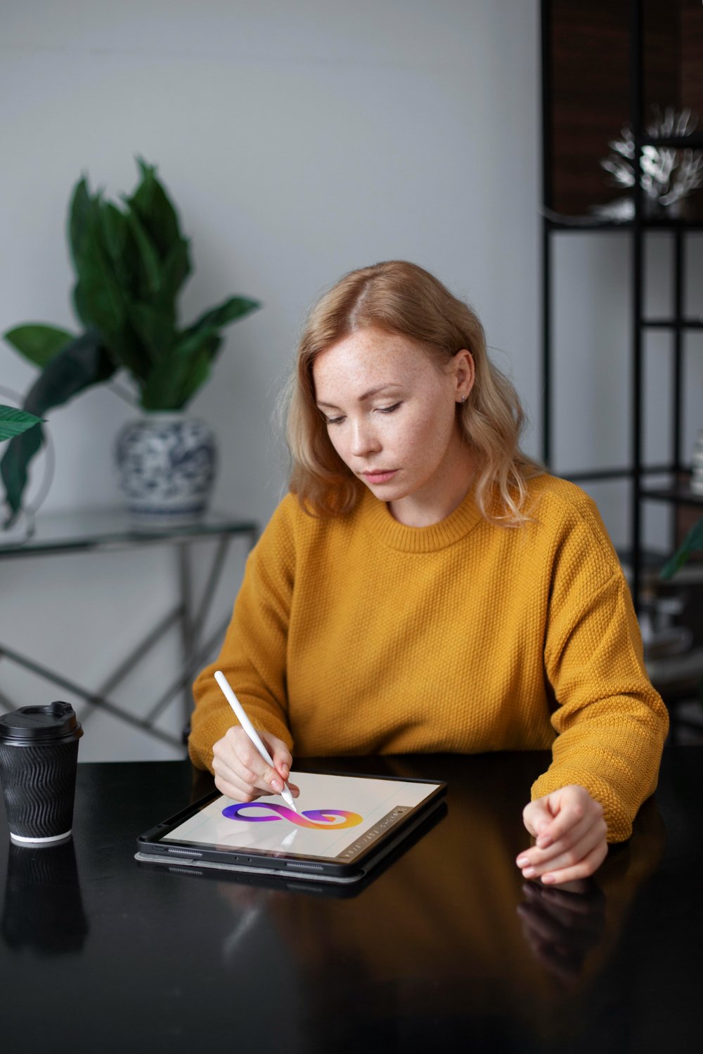 Female logo designer working on graphic tablet