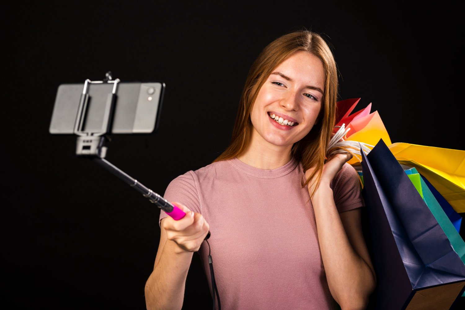 woman taking selfie with shopping bags for TikTok marketing